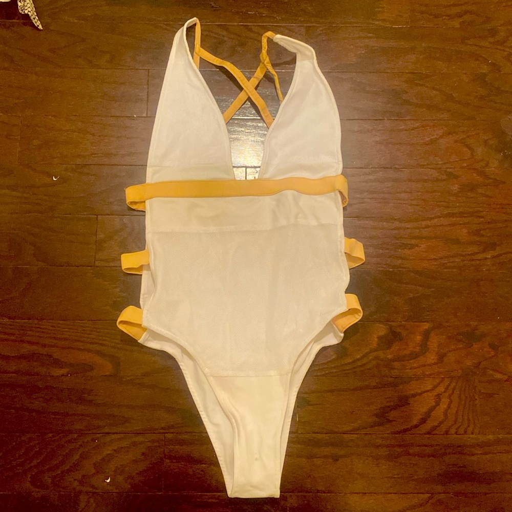 Cut out white and tan swim suit